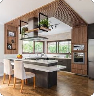 Comfortable office with plants, wooden desk, and two black chairs